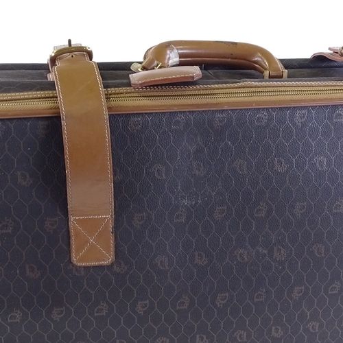 65 - CHRISTIAN DIOR - a Vintage Honeycomb Monogram roll along travel bag / suitcase, circa 1970s, coated ... 