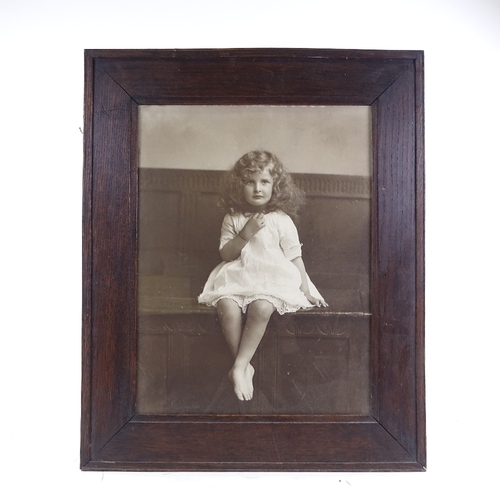 68 - A large format late 19th century photographic portrait of a child, in original frame and glazed, ove... 