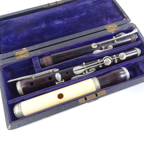 78 - A rosewood and ivory 3-section flute with nickel-plate mounts, early 20th century, no maker's marks