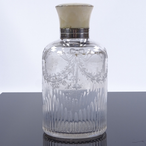 83 - A cut-glass perfume bottle with ivory-mounted silver screw top and etched floral swags, hallmarks Lo... 