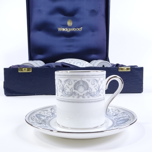 92 - A Wedgwood Dolphins 6 place bone china coffee service, dolphin and shell decoration with silvered ri... 