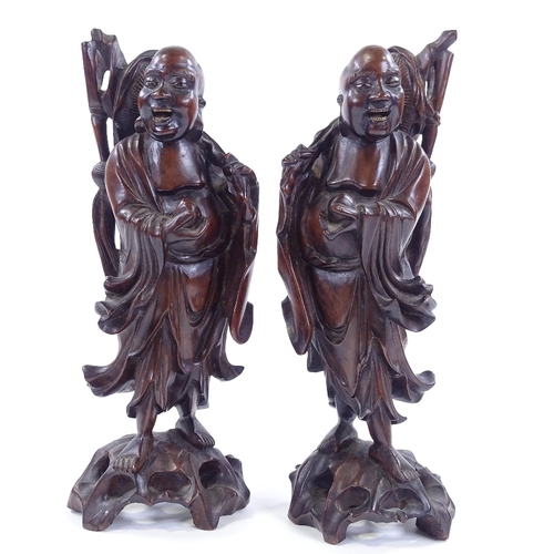 93 - A pair of oriental carved hardwood figures, largest height 36.5cm