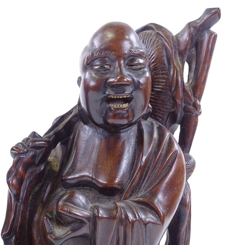 93 - A pair of oriental carved hardwood figures, largest height 36.5cm