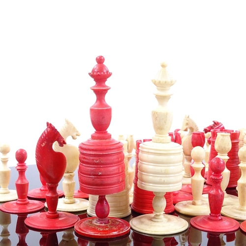 94 - A 19th century natural and red stained bone chess set, King height 10cm, together with inlaid wood b... 