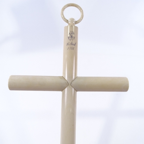 95 - A large late 19th century French hollow ivory cross, dated 1891, length excluding loop 45cm