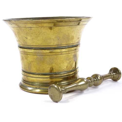 96 - An 18th century bronze bell-shaped pestle and mortar, diameter 15cm, height 12cm