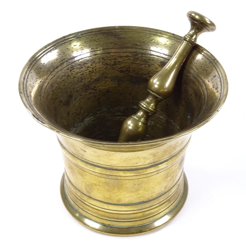 96 - An 18th century bronze bell-shaped pestle and mortar, diameter 15cm, height 12cm