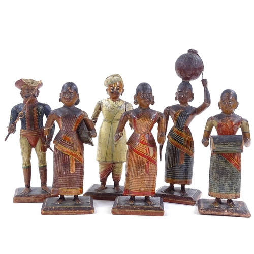 98 - A set of 6 Indian carved and painted wood and gesso standing figures, largest height 24cm