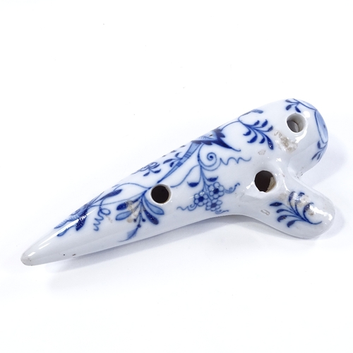 99 - A Continental blue and white porcelain ocarina flute, length 17.5cm