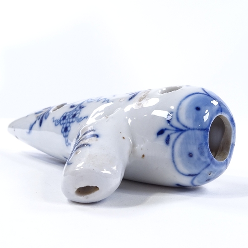 99 - A Continental blue and white porcelain ocarina flute, length 17.5cm