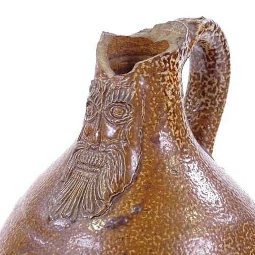 113 - A salt glaze Bellarmine stoneware flagon, 16th/17th century, height 20cm, A/F