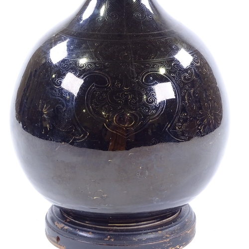 119 - A Chinese mirror black glaze porcelain bottle vase with traces of original gilded decoration, conver... 