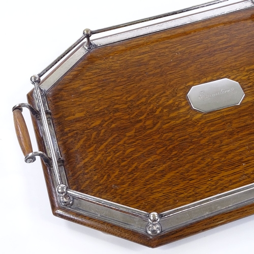 190 - An Edwardian oak tea tray with electroplate mounts, length 58cm