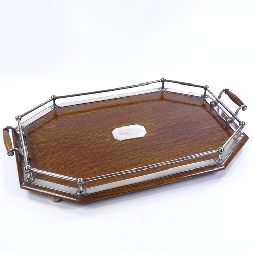 190 - An Edwardian oak tea tray with electroplate mounts, length 58cm