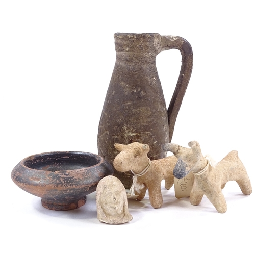 200 - A group of terracotta Antiquities, comprising a single-handled ewer with incised Christian motif, he... 