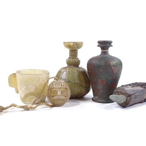 201 - A group of Antiquities, comprising a patinated Roman bronze vase, height 9cm, an iridescent glass fl... 