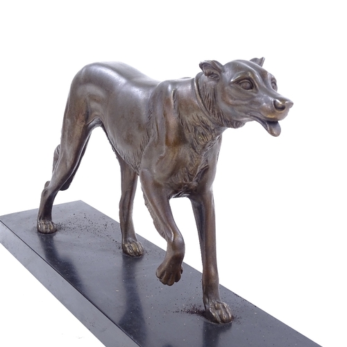 214 - A bronze patinated spelter greyhound on slate base, signed Rochard, base length 46cm