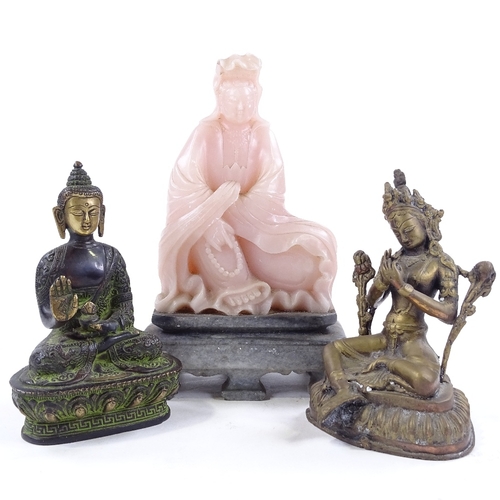 227 - 2 Oriental bronze deities, and a carved pink soapstone Buddha on stone plinth (3)