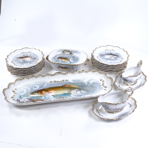 246 - A Limoges porcelain fish service for 12 people, with hand painted and gilded decoration, including a... 