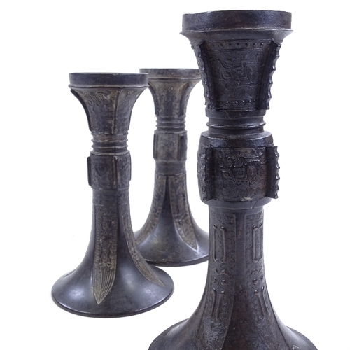 258 - 3 Chinese patinated bronze trumpet-shaped Gu vases, with relief moulded decoration, largest height 2... 