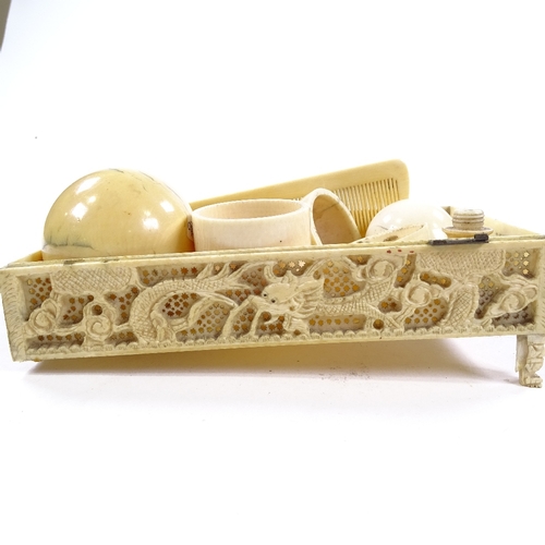 271 - A group of ivory items, including a Cantonese carved and pierced fretwork dragon design box, length ... 