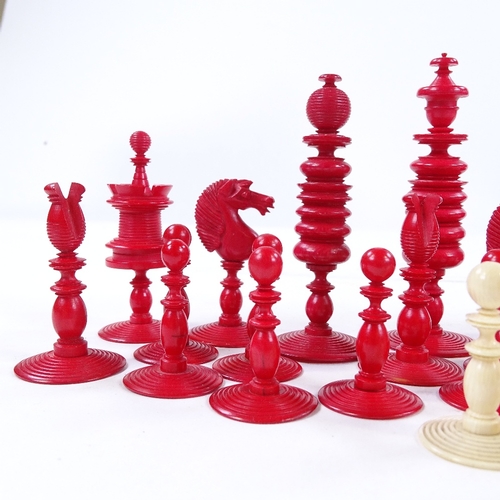 273 - A 19th century natural white and red stained ivory chess set, King height 9cm, complete and in good ... 