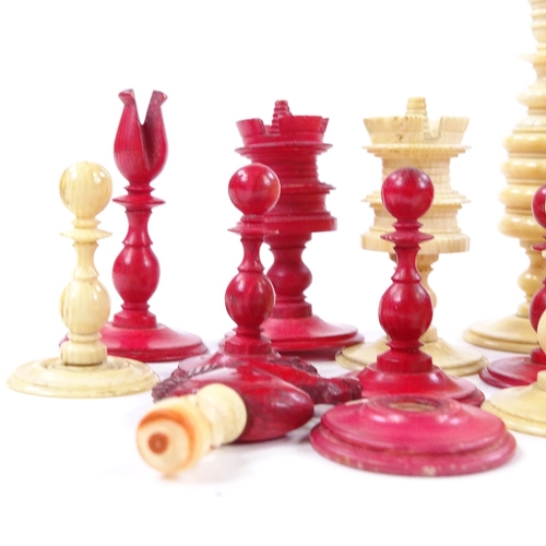 274 - A 19th century natural and red stained ivory chess set, King height 8cm, complete and in good condit... 