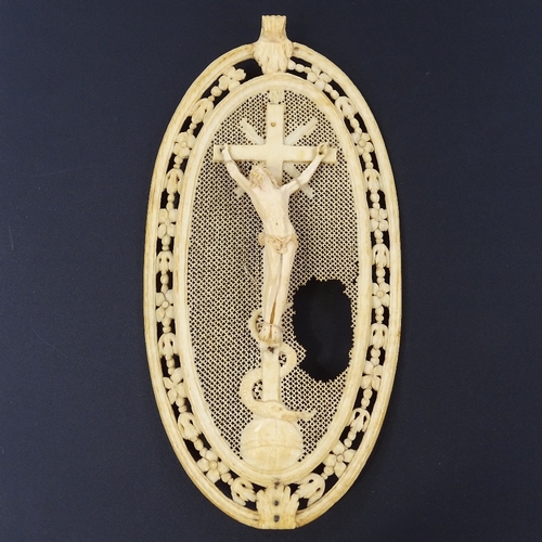 280 - An 18th century Dieppe ivory plaque depicting the crucifixion, height 15.5cm