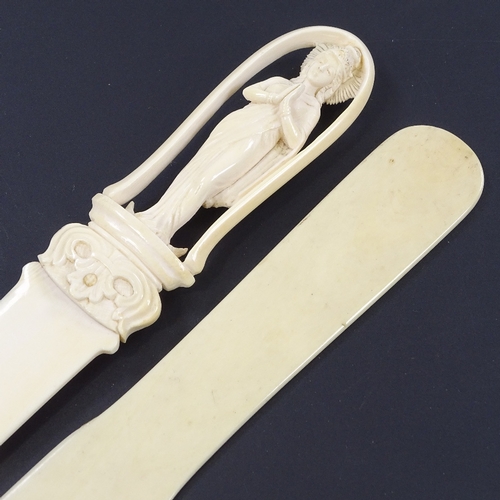 283 - A Chinese ivory paper knife with relief carved handle in the form of a deity, length 30cm, and a pla... 