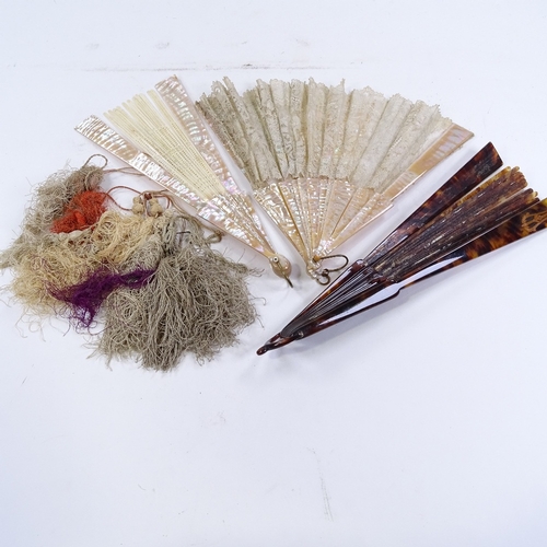 285 - A group of Antique fans, including mother-of-pearl and lace, a tortoiseshell fan frame, and fan tass... 