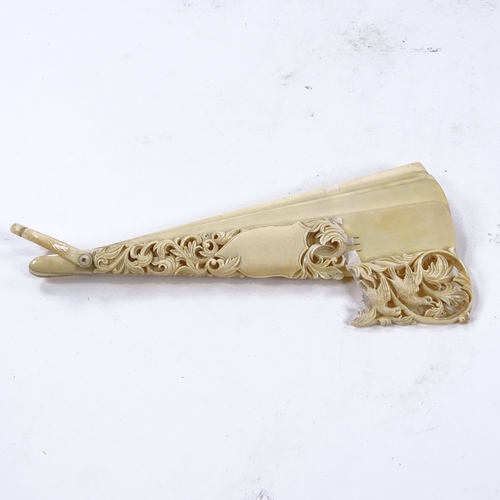 286 - A 19th century Dieppe ivory Brise fan, with carved and pierced dove decorated guard