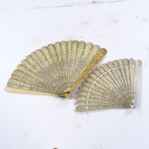 288 - A 19th century Chinese carved ivory fan, and a similar ivory fan with no guards