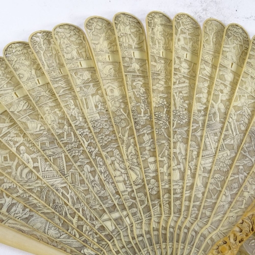 288 - A 19th century Chinese carved ivory fan, and a similar ivory fan with no guards