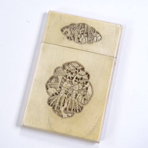 292 - A 19th century Chinese ivory card case with relief carved covers, length 10.5cm