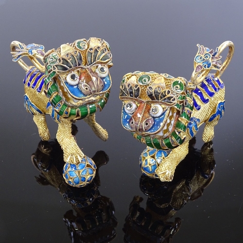 211 - A pair of Chinese silver-gilt and enamel Dogs of Fo, length 8cm