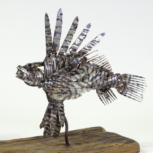 1303 - Clive Fredriksson, metal sculpture, lion fish on natural wooden base, base length 16