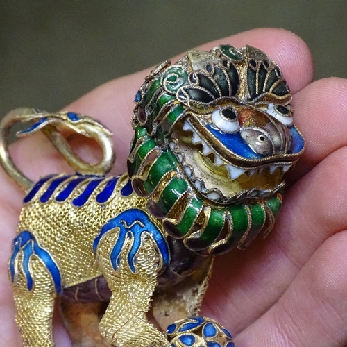 211 - A pair of Chinese silver-gilt and enamel Dogs of Fo, length 8cm