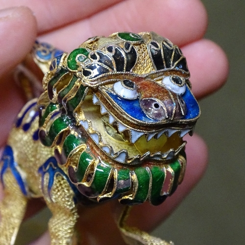 211 - A pair of Chinese silver-gilt and enamel Dogs of Fo, length 8cm