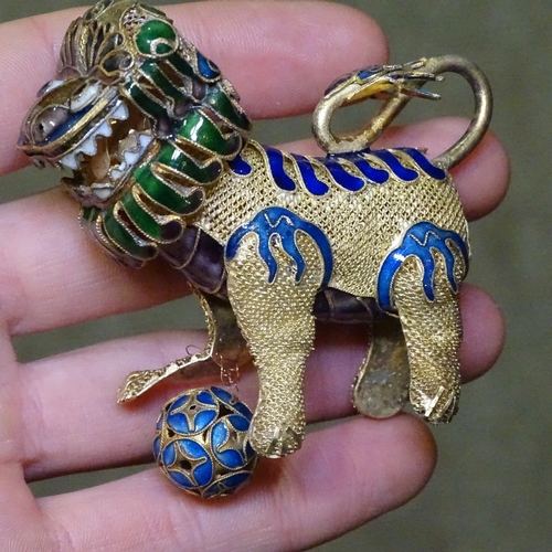 211 - A pair of Chinese silver-gilt and enamel Dogs of Fo, length 8cm