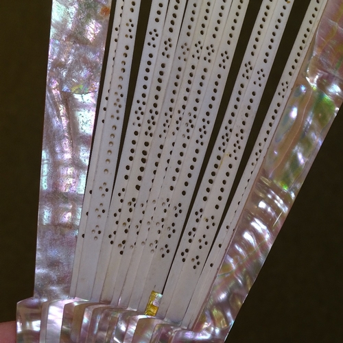 285 - A group of Antique fans, including mother-of-pearl and lace, a tortoiseshell fan frame, and fan tass... 