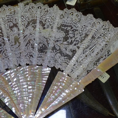 285 - A group of Antique fans, including mother-of-pearl and lace, a tortoiseshell fan frame, and fan tass... 