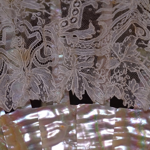 285 - A group of Antique fans, including mother-of-pearl and lace, a tortoiseshell fan frame, and fan tass... 