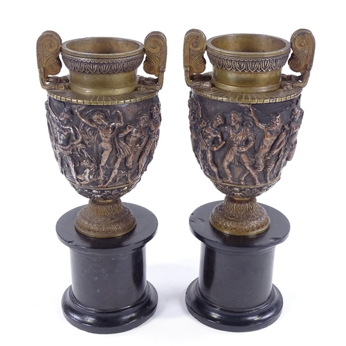 213 - A pair of 19th century relief moulded bronze Classical urns, by John Grinsell & Sons of Birmingham, ... 