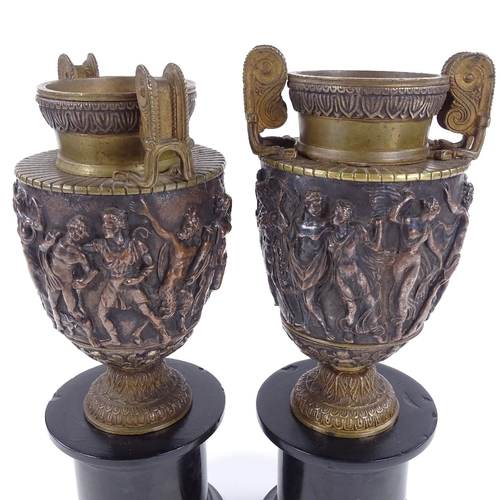 213 - A pair of 19th century relief moulded bronze Classical urns, by John Grinsell & Sons of Birmingham, ... 