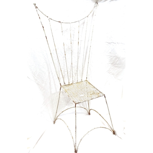 230 - A small white painted wrought-iron doll's chair, with pierced seat and wirework wing-back, height 80... 