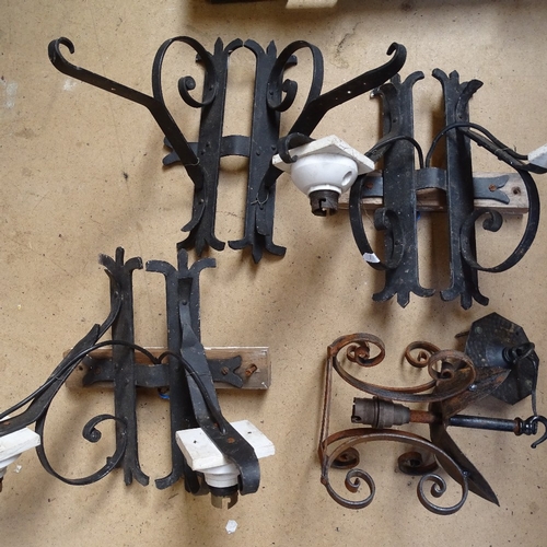 241 - Wrought-iron wall light fittings, and a small hanging lamp