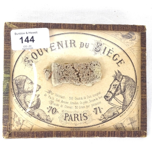 144 - A Souvenir Du Siege, containing a ration of bread made from oats, starch, sawdust and horsemeat - on... 