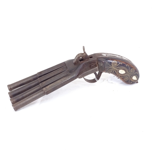 261 - A reproduction 4-barrel duck-foot percussion pistol, brass and mother-of-pearl inlaid grips, and bel... 