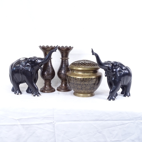 268 - 2 African carved ebony elephants, and 3 black enamelled brass posy holders (5)