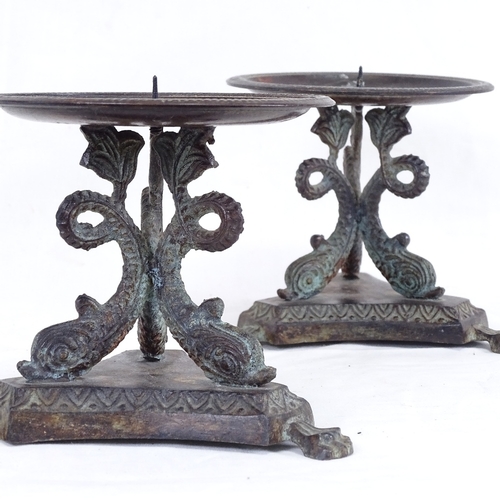 280 - A pair of verdigris bronze candlesticks, dolphin bases with lion paw feet, height 11cm